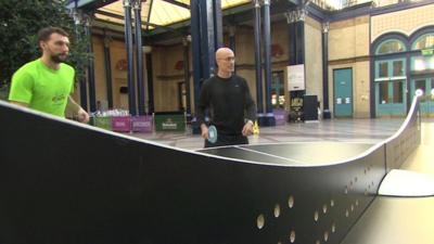 Men playing ping pong