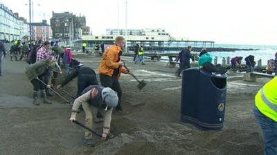 Volunteers help to clean up Aberystwyth promenade