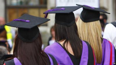 Three girls attending a graduation ceremony