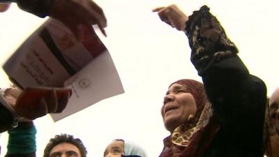 Woman pointing at the referendum document