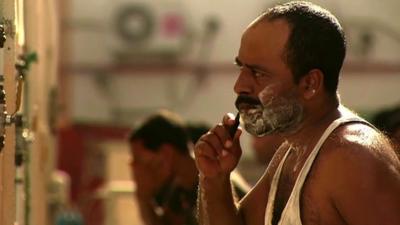 Migrant worker shaving