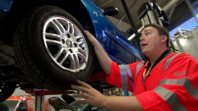 RAC technician Matt Woodbridge with damaged car