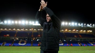 Kidderminster Harriers manager Andy Thorn applauds the visiting fans after his side's FA Cup win at Peterborough