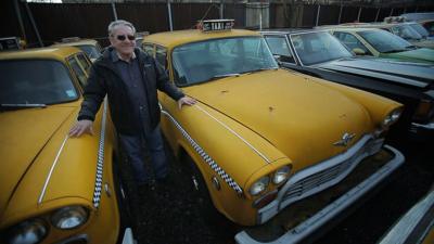 Gino Lucci standing by a car