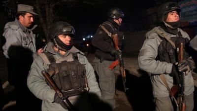 Afghan security forces at the site of a suicide attack in Kabul, Afghanistan