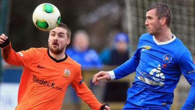 Glenavon's Tiarnan Mulvenna in action against Ryan Campbell of Ballinamallard