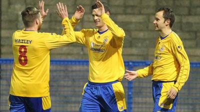 Gary Liggett of Dungannon Swifts is congratulated after scoring against Ards