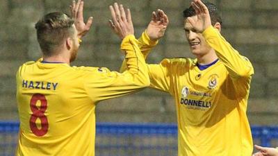 Gary Liggett of Dungannon Swifts is congratulated after scoring against Ards