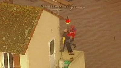 A man is rescued from his home