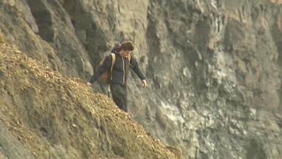 Man near cliffs in Dorset