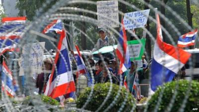 Anti-government protesters wave national flags