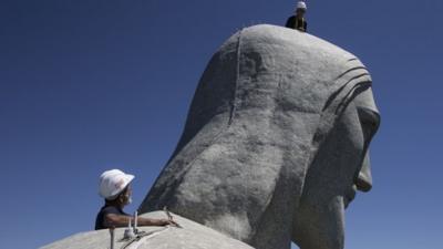 Repairmen on the head of the Christ the Redeemer statue