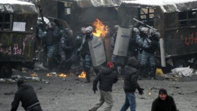 Riot police officers gather during clashes with protesters in Kiev