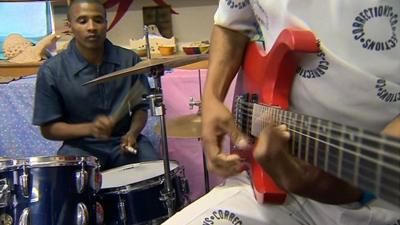 Musicians rehearsing in prison