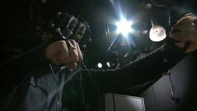 UCL's William Steptoe manipulates websites using a head-mounted display and panels on his hands
