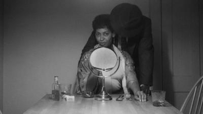 Carrie Mae Weems and a man in her Kitchen Table series