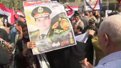 Supporters of the military and government waving posters of General Sisi in Tahrir Square