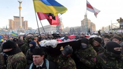 People carrying a coffin