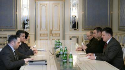 Ukraine's President Viktor Yanukovych, second left, talks to opposition leaders in Kiev