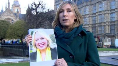 Political correspondent Vicki Young with picture of Lib Dem candidate Lorely Burt