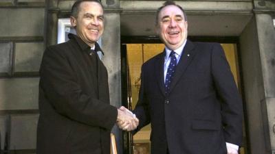 Bank of England governor Mark Carney, left, meets Scottish First Minister Alex Salmond as he arrives at Bute House in Edinburgh