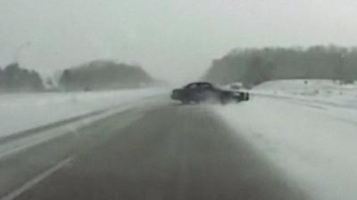 Car spins in road in US