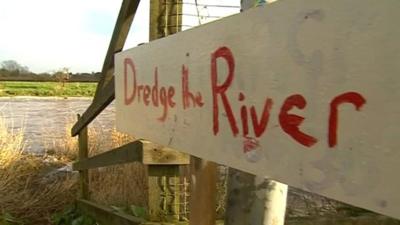 Dredge the river sign