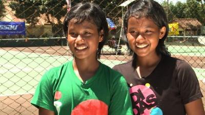 Young Indonesian tennis playing twins Fitriani Sabatini (green, left) and Fitriana Sabrina Mastuti