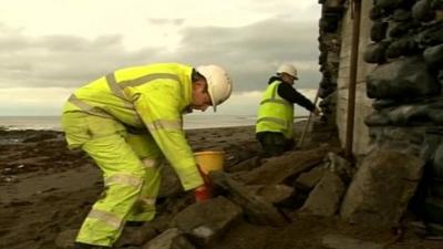 Workers fixing sea wall in Aberystwyth