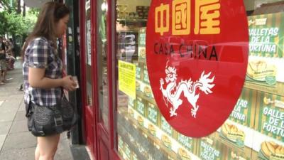 Woman outside 'Casa China' shop