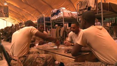 US troops play cards