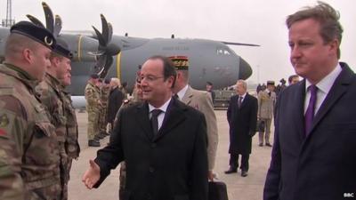 France's President Francois Hollande and British PM, David Cameron, at welcoming ceremony at RAF Brize Norton, Oxfordshire