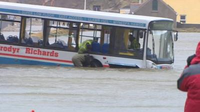 Bus stuck in water