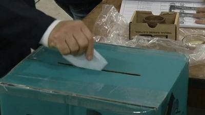 Vote being posted in ballot box