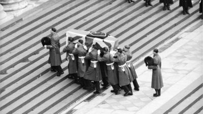 Soldiers carry coffin of Sir Winston Churchill up steps of St Paul's 1965