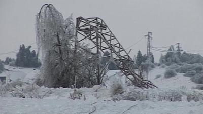 Collapsed pylon in snow