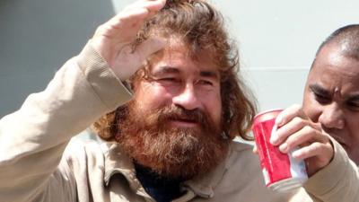 Jose Salvador Albarenga waving at crowds