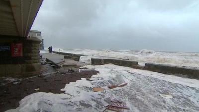 Debris washed up on sea front in Dawlish