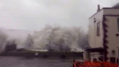 Waves overtopped Chesil Beach by the Little Ship pub in Victoria Square, Portland