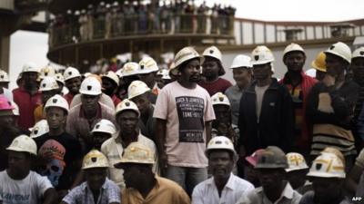 Miners gather to mourn after fire