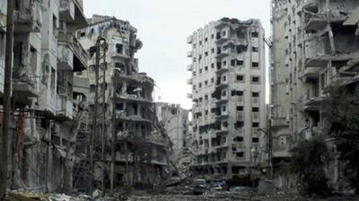 Badly damaged buildings in Homs