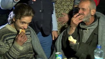 Two people eating