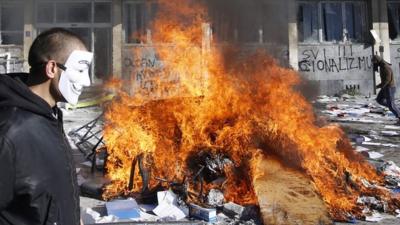 Protestors burn documents from a government building in Tuzla, Bosnia