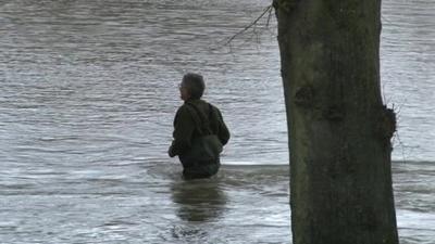 Man wading through water