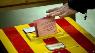 A Swiss voter casts his vote leaves at a makeshift polling station