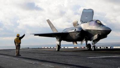 An F-35B Lightning II prepares for take off from the flight deck of the amphibious assault ship USS Wasp