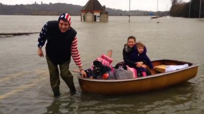 Rory and Samantha Dwyer leave their home by boat with daughter Georgiana