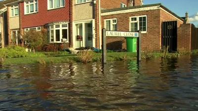 The street sign and flood water