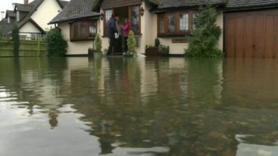 House surrounded by floodwater