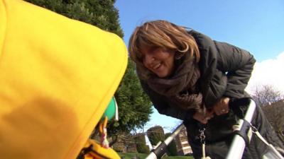 Sue Nelsey with child in buggy